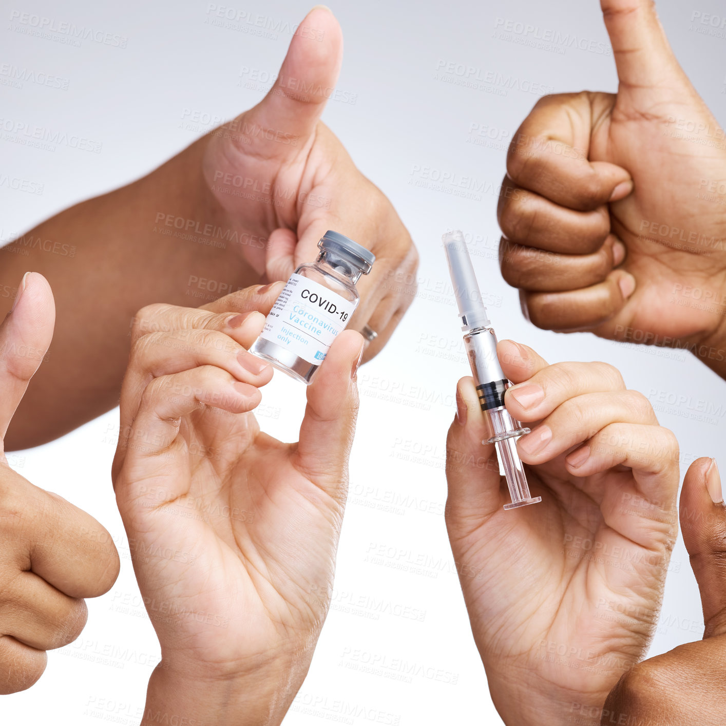 Buy stock photo Studio shot of a group of people showing thumbs up and holding the vaccine against a grey background