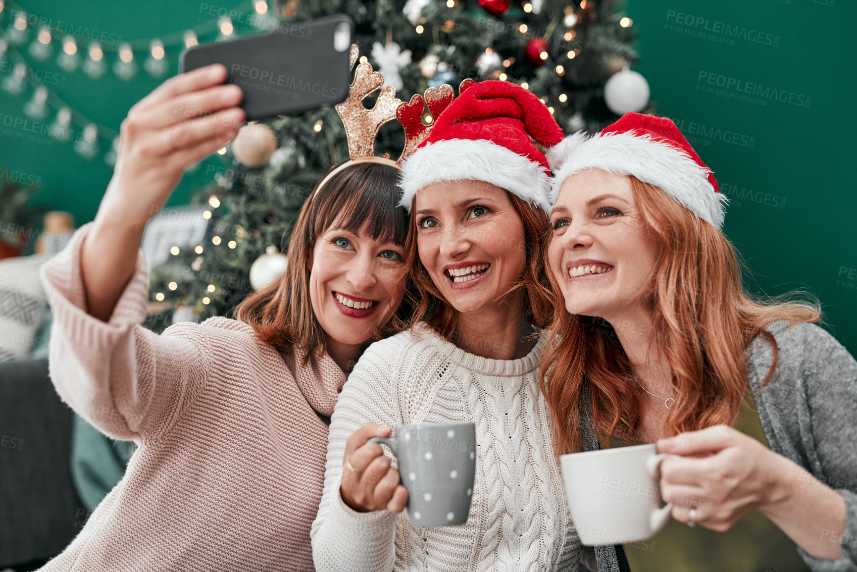 Buy stock photo Women, selfie and reunion for Christmas in living room with smile, celebration and together with coffee. Technology, friends and happy in apartment for relax, vacation and drink for festive season