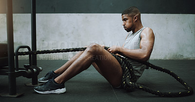 Buy stock photo Health, fitness and man with weight sled at gym for training, power and intense cardio on wall background. Performance, endurance and male person with rope for strong, muscle or core workout on floor