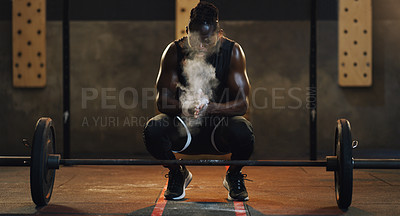 Buy stock photo Weightlifting, powder and black man with barbell in gym for training, exercise and serious workout. Sports, strong muscle and male body builder lifting weights for challenge, wellness and strength
