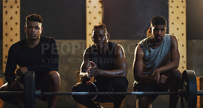 Buy stock photo Portrait of a group of muscular young men exercising together in a gym