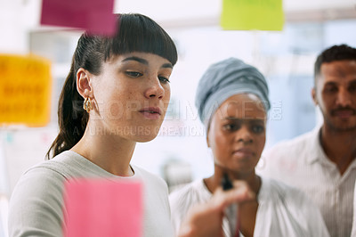 Buy stock photo Business people, teamwork and planning on glass board in meeting for brainstorming, project workflow and goals. Collaboration, employees or coworkers in office for idea or solution on sticky notes