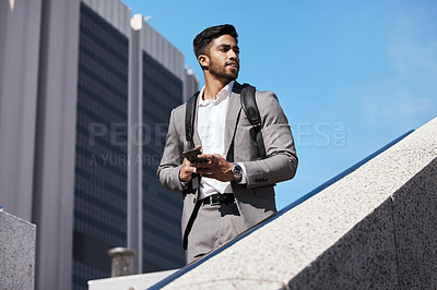 Buy stock photo Phone, city and businessman walking on stairs by building for travel while thinking. Confidence, technology and professional male employee browsing on cellphone commuting to work in urban town street