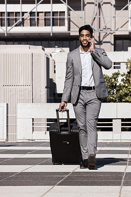 Buy stock photo Phone call, travel and luggage with a businessman walking in the city for a company trip. Mobile, communication or suitcase with a young male employee talking while on a commute outdoor in town