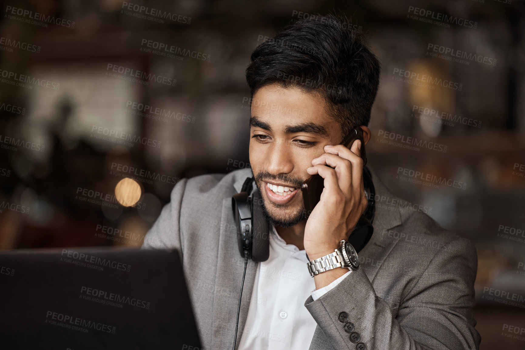 Buy stock photo Shot of a young businessman working in a cafe