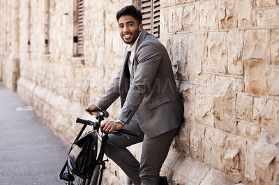 Buy stock photo Bicycle, portrait and happy business man in city for carbon neutral, sustainable and transport. Bike, commute and Indian male person on cycling break, smile and relax while traveling in India
