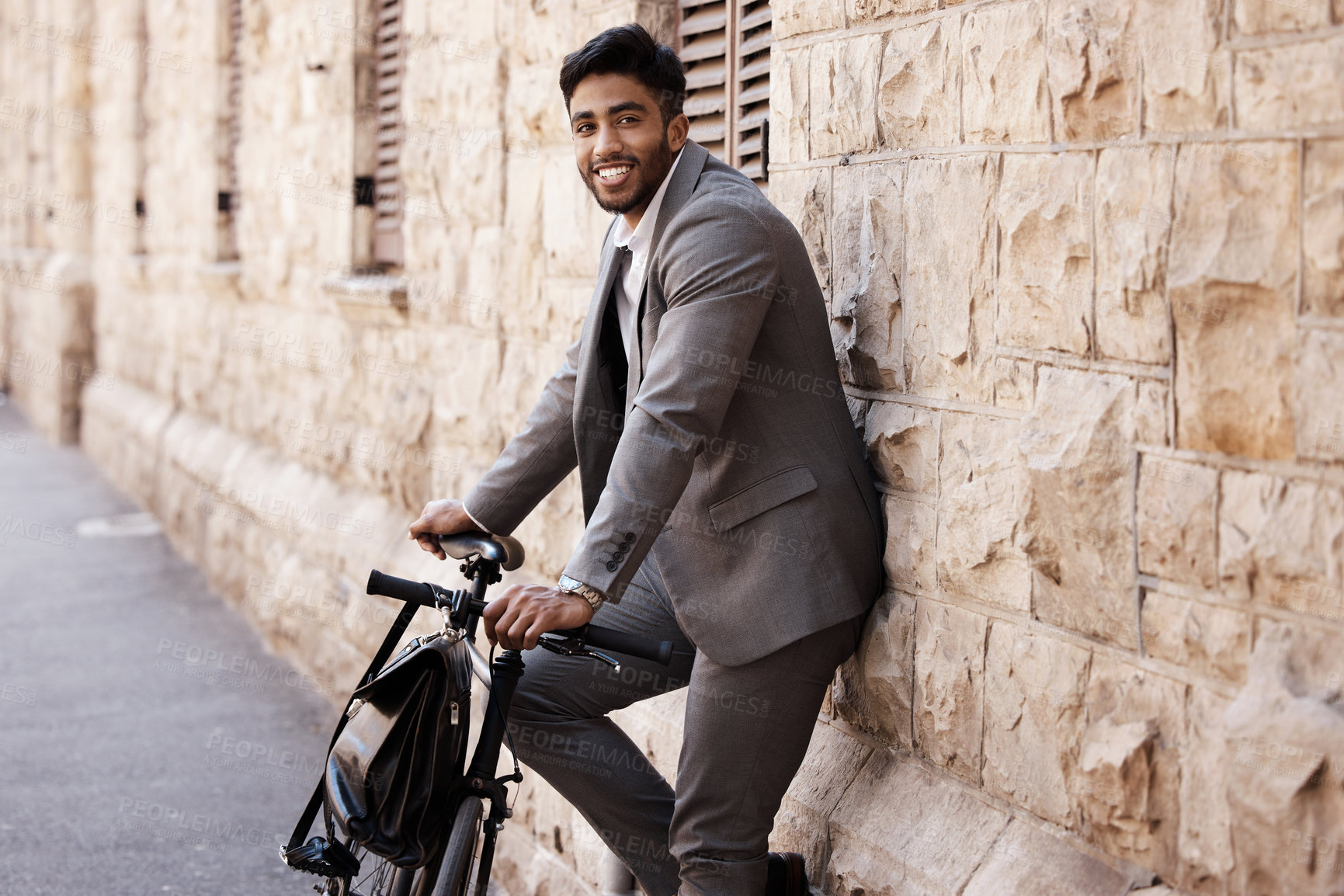 Buy stock photo Bicycle, portrait and happy business man in city for carbon neutral, sustainable and transport. Bike, commute and Indian male person on cycling break, smile and relax while traveling in India