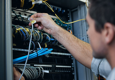 Buy stock photo Server room, technician and hands of man with cable for programming, cybersecurity or maintenance. IT person in datacenter for network connection, software or system upgrade for internet or hardware