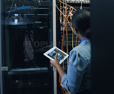 Buy stock photo Server room, engineer and woman with a tablet for programming, cybersecurity or cable maintenance. Black female technician or IT in datacenter for network, software system upgrade with technology