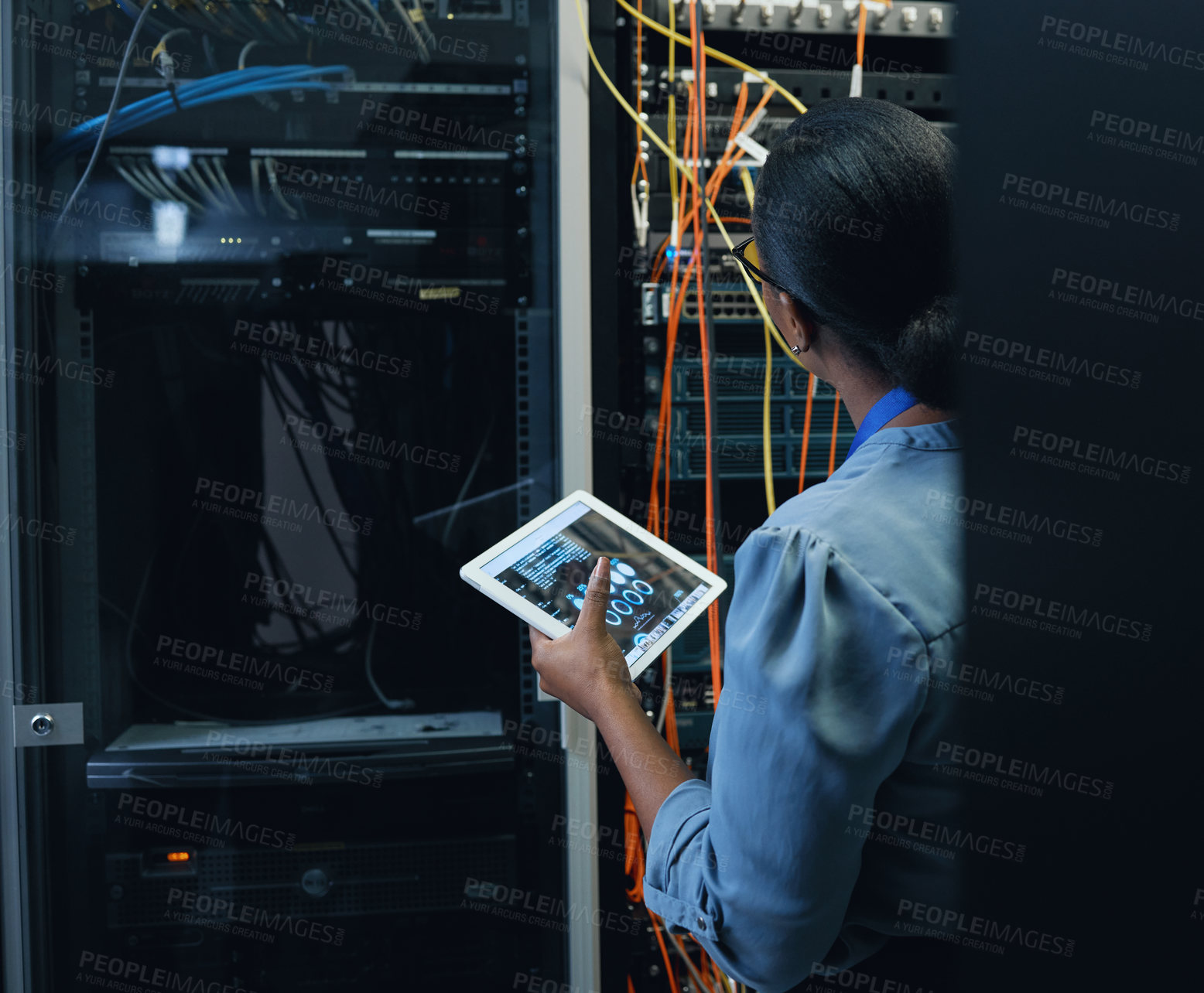 Buy stock photo Server room, engineer and woman with a tablet for programming, cybersecurity or cable maintenance. Black female technician or IT in datacenter for network, software system upgrade with technology