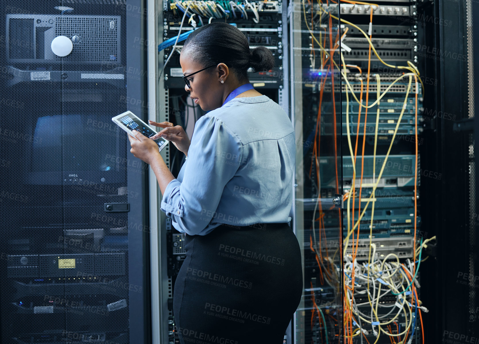 Buy stock photo Server room, woman and engineer with tablet for cybersecurity, programming or cable maintenance. Black female technician in datacenter for network, software or system upgrade with IT app and internet
