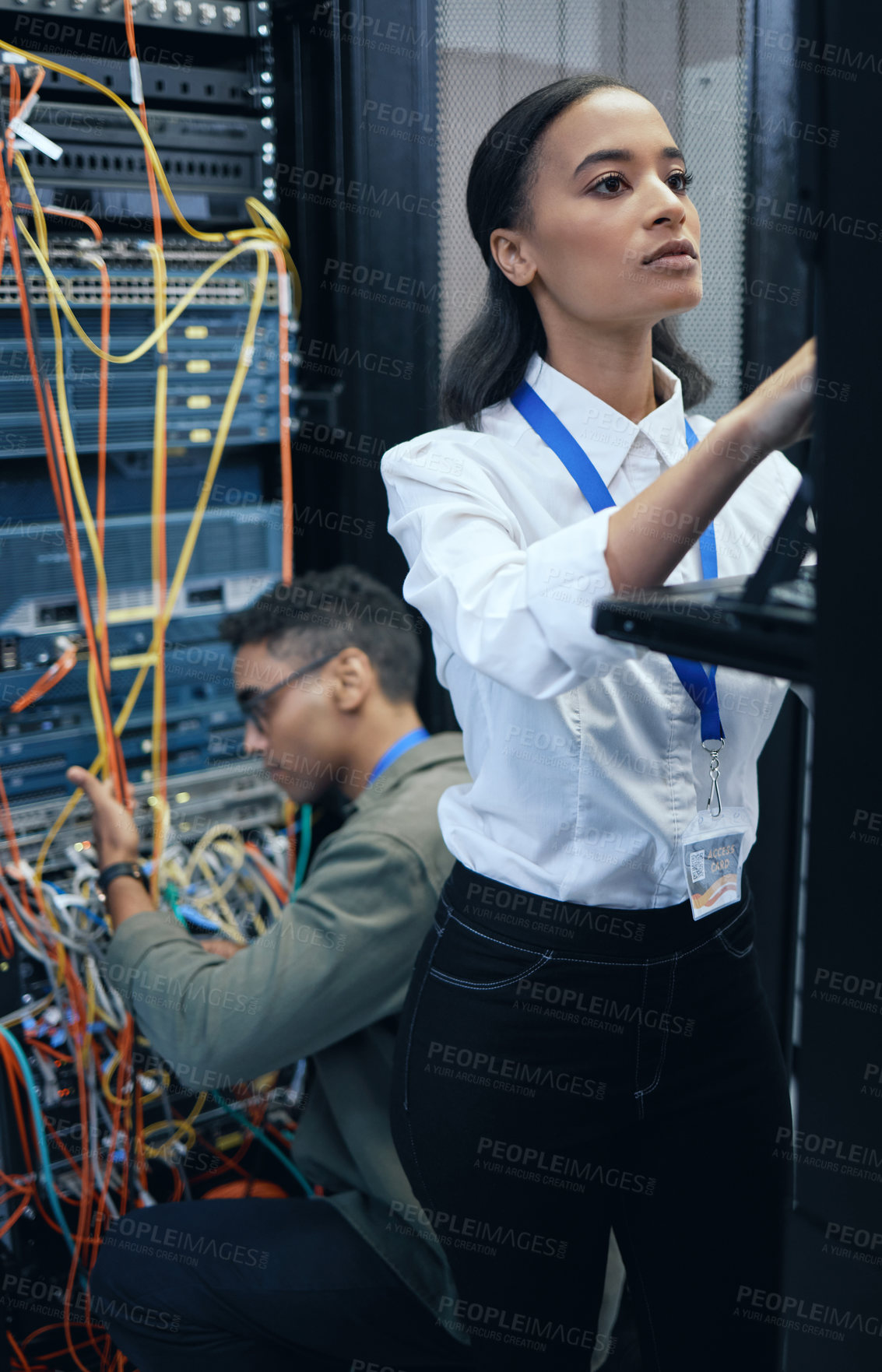 Buy stock photo Server room, engineer or IT team working together for programming, cybersecurity or maintenance. African woman and man technician in datacenter for network, software and server or system upgrade