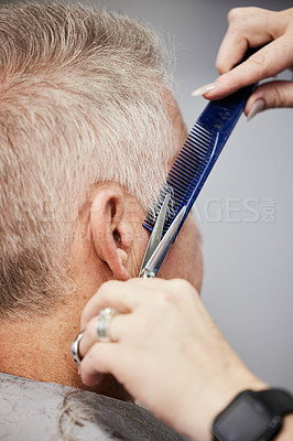 Buy stock photo Shot of a man getting a haircut in a salon