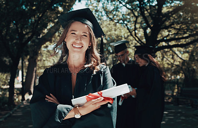 Buy stock photo Shot of a student holding her diploma on graduation day