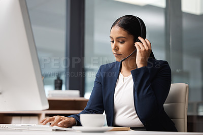 Buy stock photo Computer, telemarketing and woman typing in call center office for customer service, help desk or technical support. Crm, contact us and female sales agent, business consultant or employee listening.