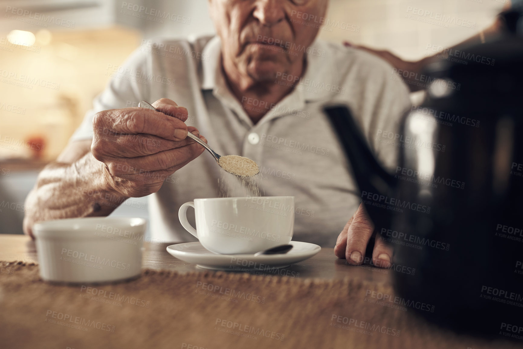 Buy stock photo Shot of a senior man having a cup of coffee at home
