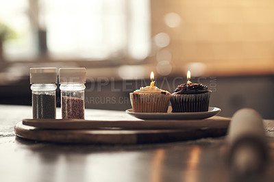 Buy stock photo Shot of cupcakes on a plate in a kitchen