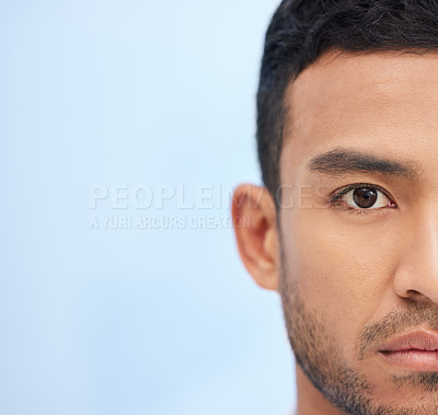 Buy stock photo Cropped shot of a young businessman standing alone in the office during the day