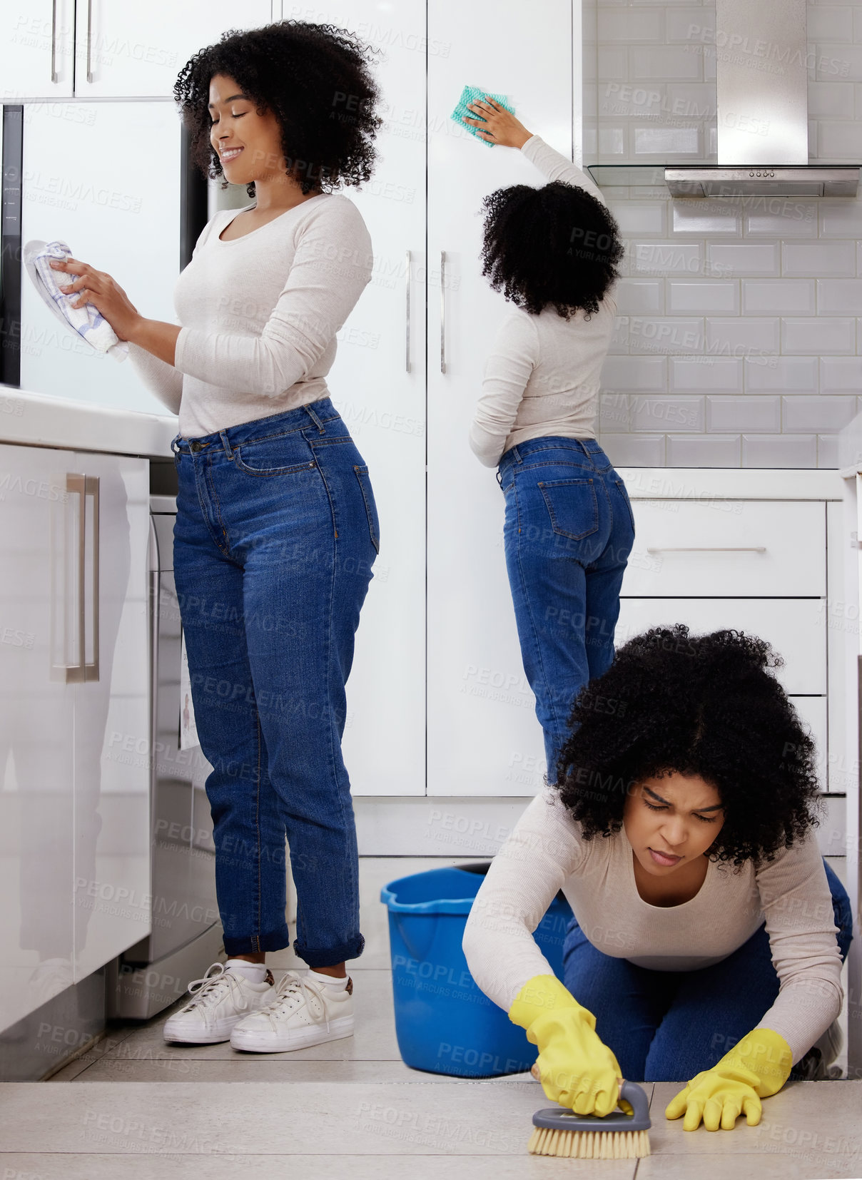 Buy stock photo Shot of a young woman cleaning the house