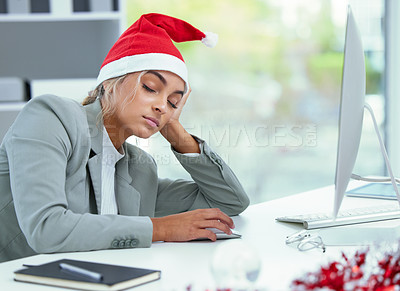 Buy stock photo Shot of a sleepy woman catching a nap at her desk in the office