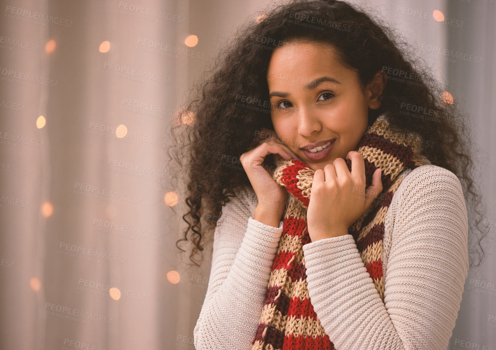 Buy stock photo Portrait of a young woman wearing a scarf during Christmas at home