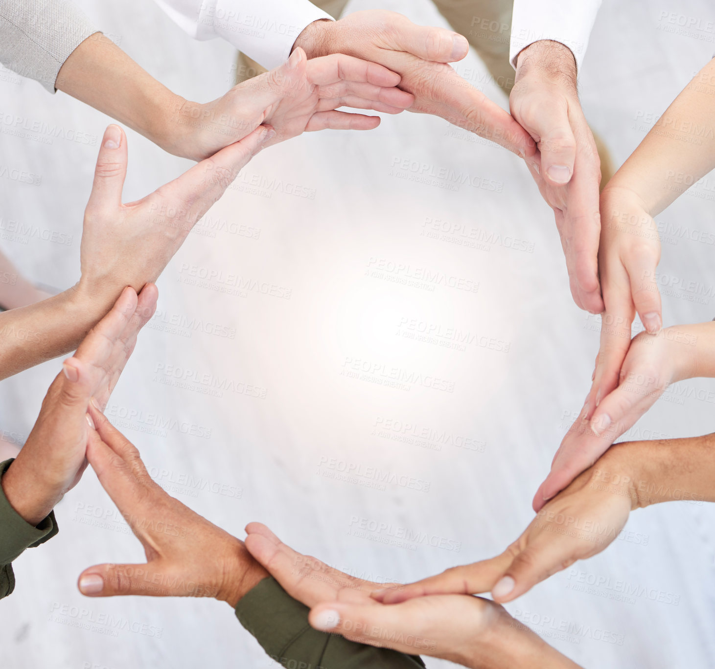 Buy stock photo Shot of a group of business people with their hands together in a circle