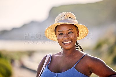 Buy stock photo Black, woman and portrait on beach with smile for vacation, travel or relax in Thailand. Female tourist and ocean or happiness for holiday in tropical climate, sunshine in nature with straw hat