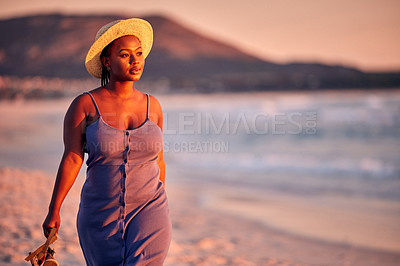 Buy stock photo Shot of a beautiful young woman enjoying alone time at the beach