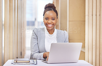 Buy stock photo Cropped portrait of an attractive young businesswoman working on her laptop in the office