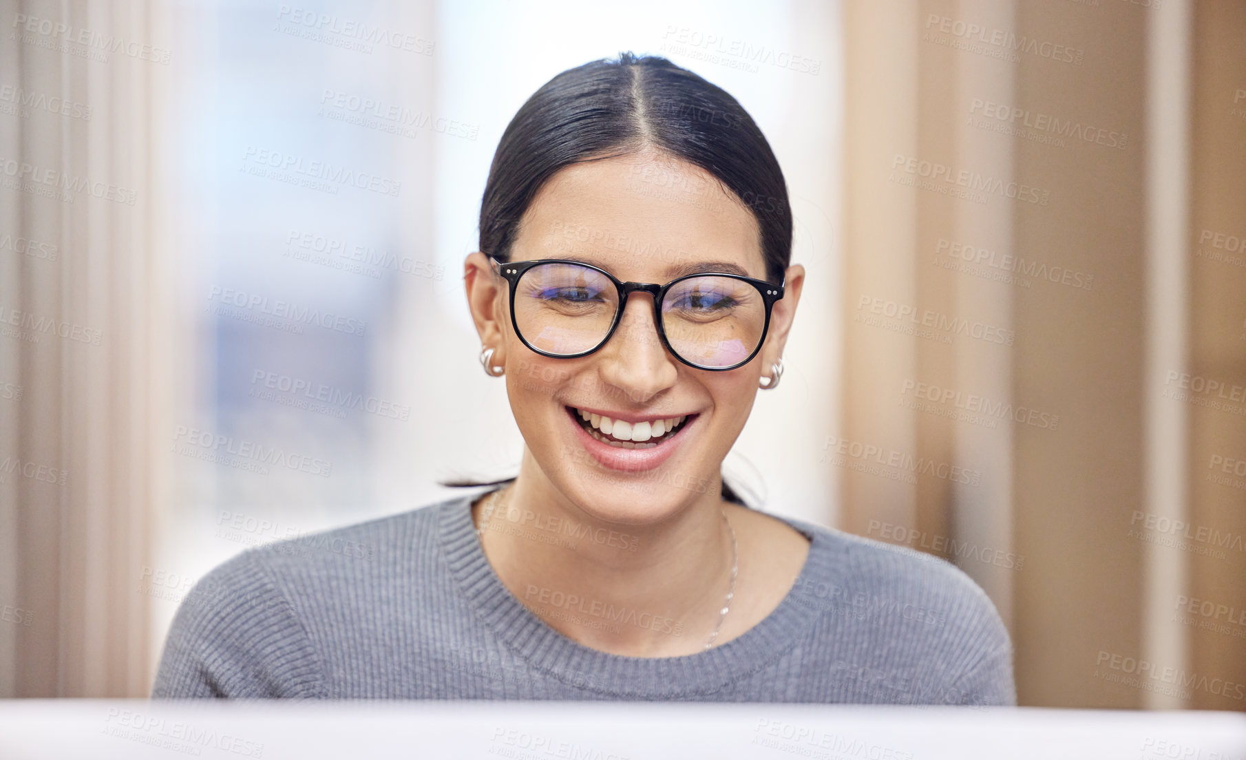 Buy stock photo Cropped shot of an attractive young businesswoman working on her laptop in the office