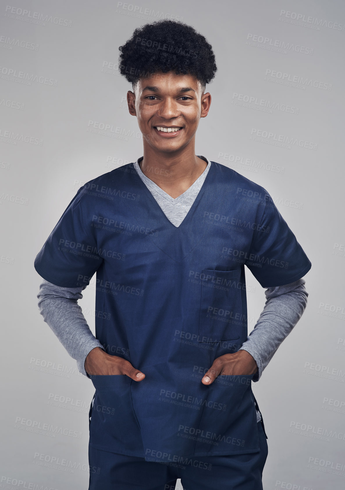 Buy stock photo Shot of a medical practitioner standing against a grey background