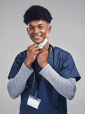 Buy stock photo Shot of a medical practitioner standing against a grey background