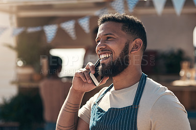 Buy stock photo Shot of a business owner using his smartphone to make a call