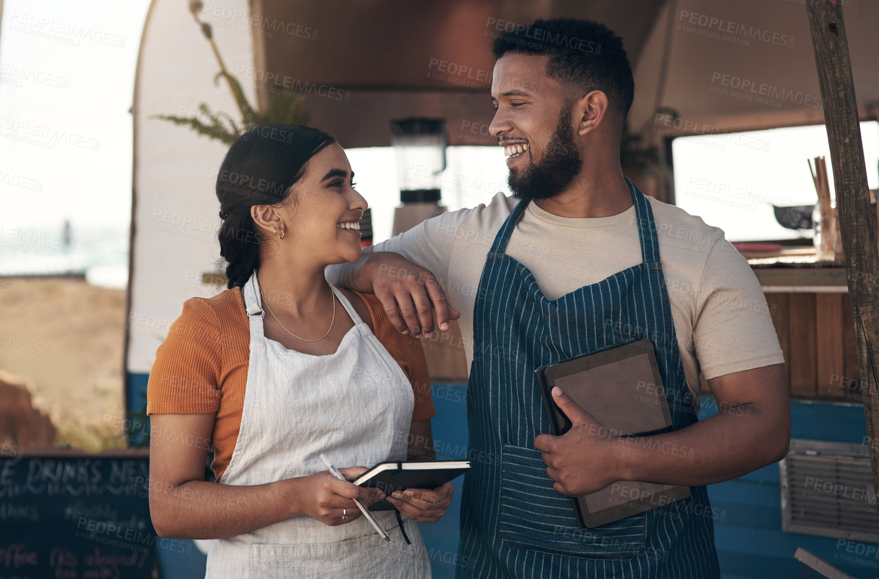 Buy stock photo Shot of two a businessman planning for the day with his staff