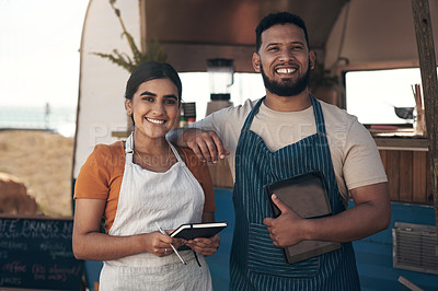 Buy stock photo Shot of two a businessman planning for the day with his staff