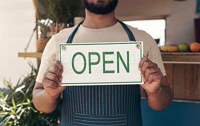 Buy stock photo Shot of a businessman holding an open business sign