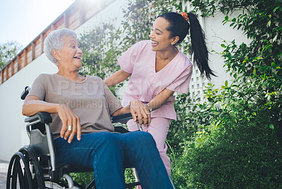 Buy stock photo Shot of a young nurse caring for an older woman in a wheelchair