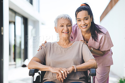 Buy stock photo Portrait of a young nurse caring for an older woman in a wheelchair