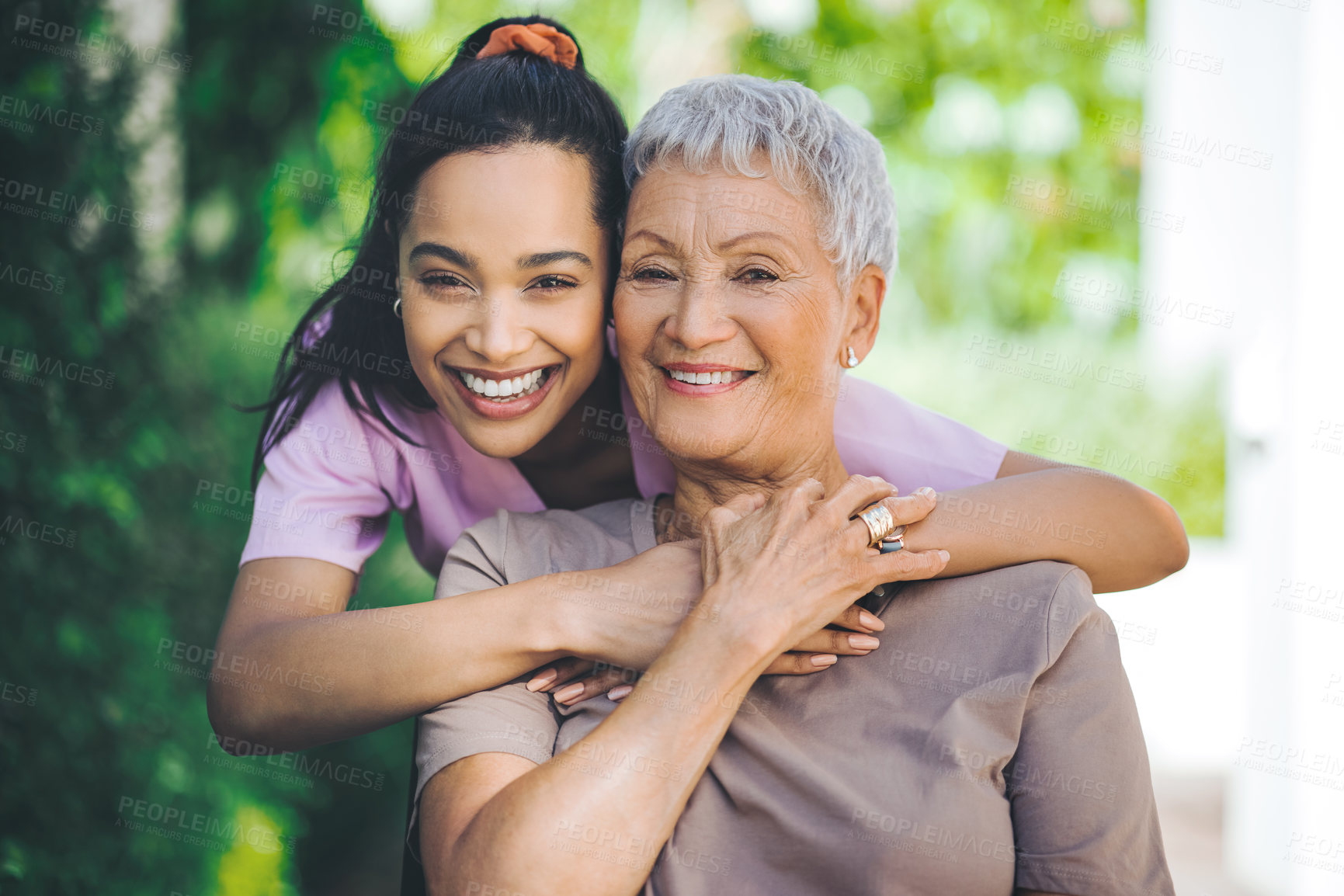 Buy stock photo Portrait of a young nurse caring for an older woman