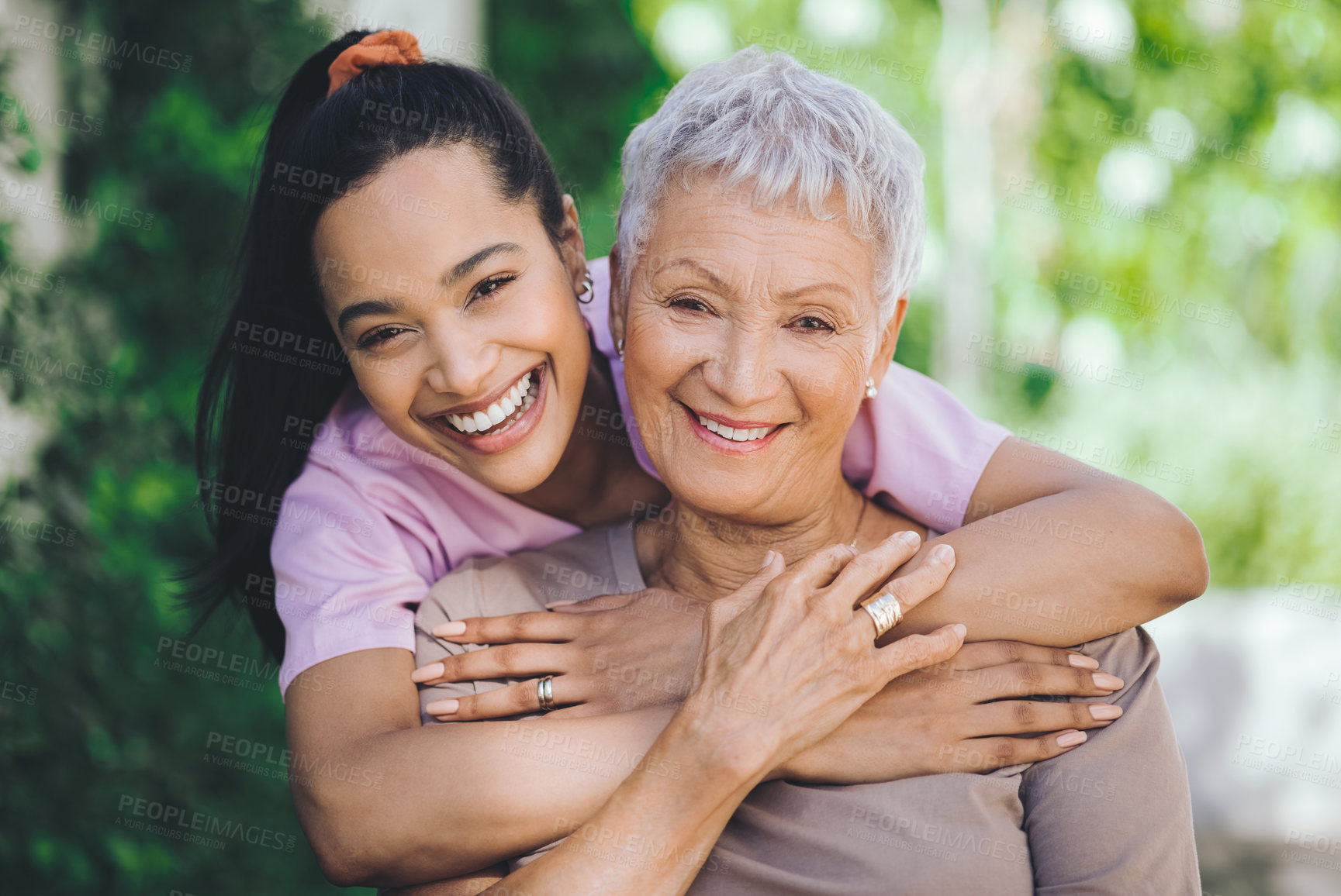 Buy stock photo Portrait of a young nurse caring for an older woman