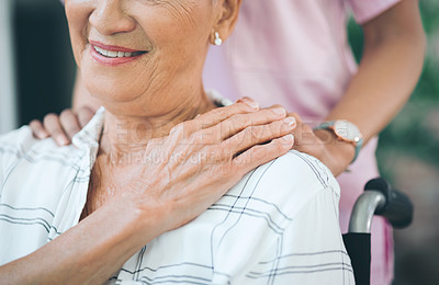 Buy stock photo Cropped shot of a nurse caring for an older woman in a wheelchair