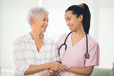 Buy stock photo Shot of an older woman being assisted by her physiotherapist