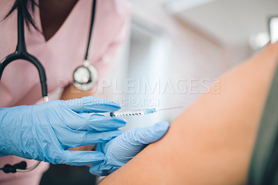 Buy stock photo Cropped shot of a doctor giving an unrecognizable woman an injection inside