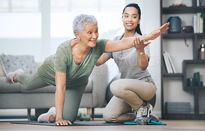 Buy stock photo Shot of an older woman doing light floor exercises during a session with a physiotherapist outside
