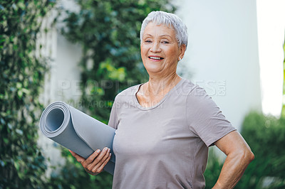 Buy stock photo Portrait of an older woman holding an exercise mat before her workout outside