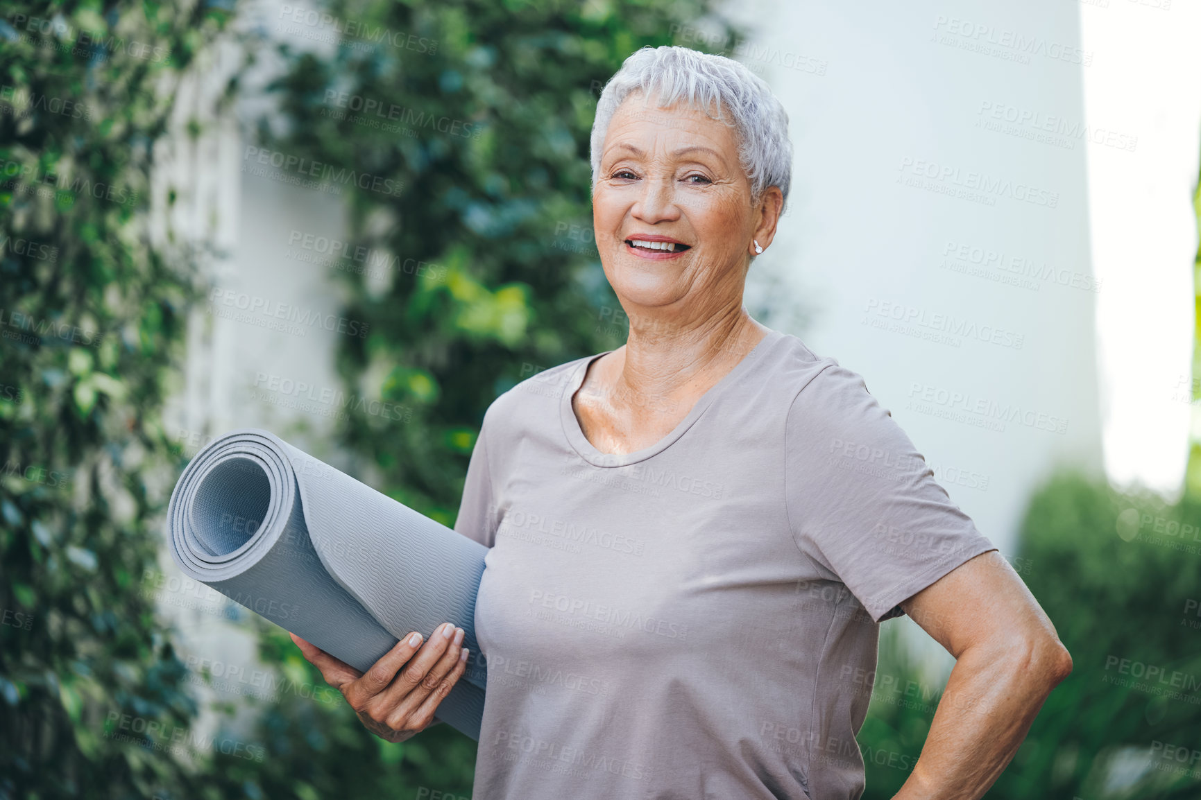 Buy stock photo Portrait of an older woman holding an exercise mat before her workout outside