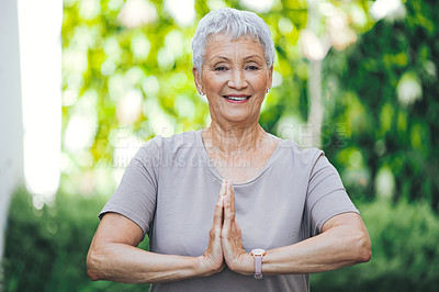 Buy stock photo Portrait of an older woman meditating outside