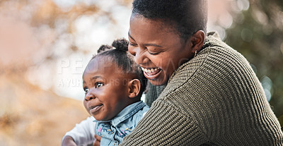 Buy stock photo Shot of a mother bonding with her daughter outdoors