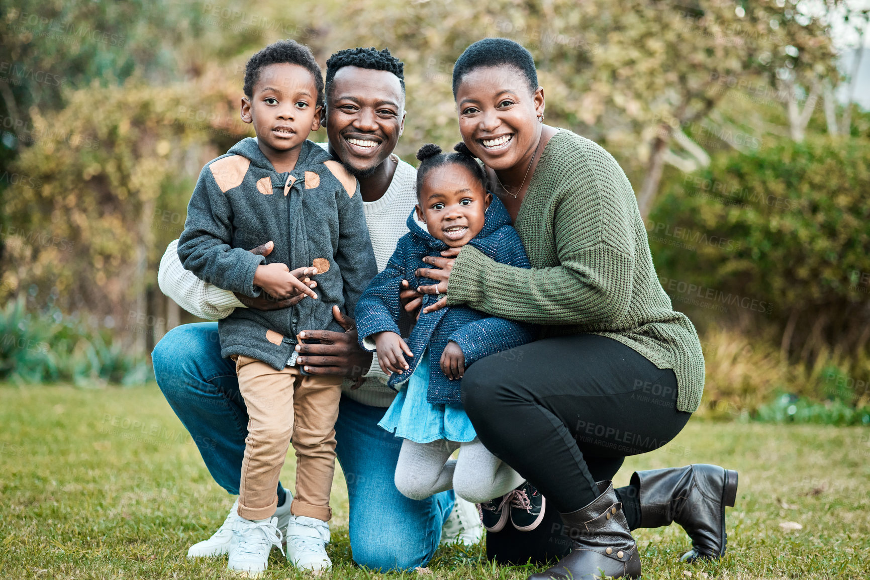 Buy stock photo Portrait of a happy family spending time outdoors