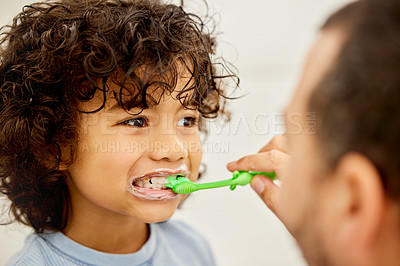 Buy stock photo Child, brushing teeth and father helping in a bathroom with dental health and cleaning. Morning routine, toothbrush and kid with dad together showing hygiene care of mouth at home with grooming